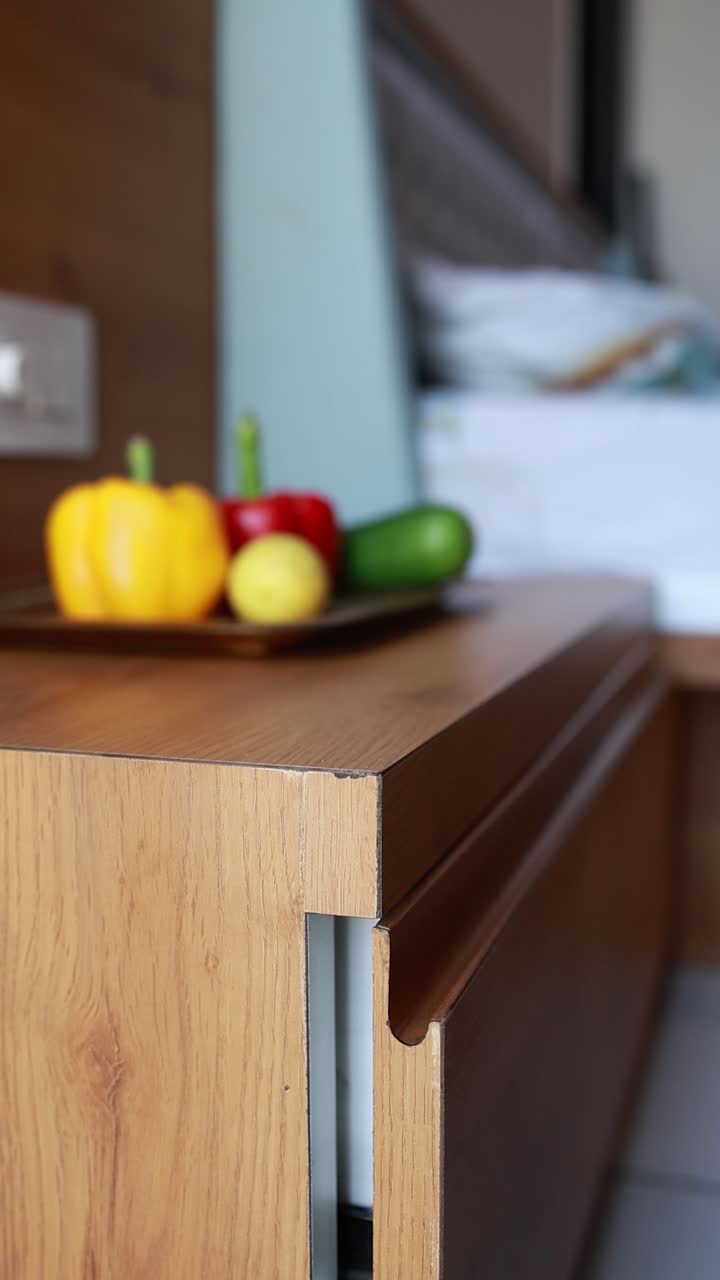 blurred modern kitchen interior and focus on the sliding furniture door.