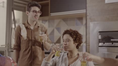 friends toasting and socializing at home