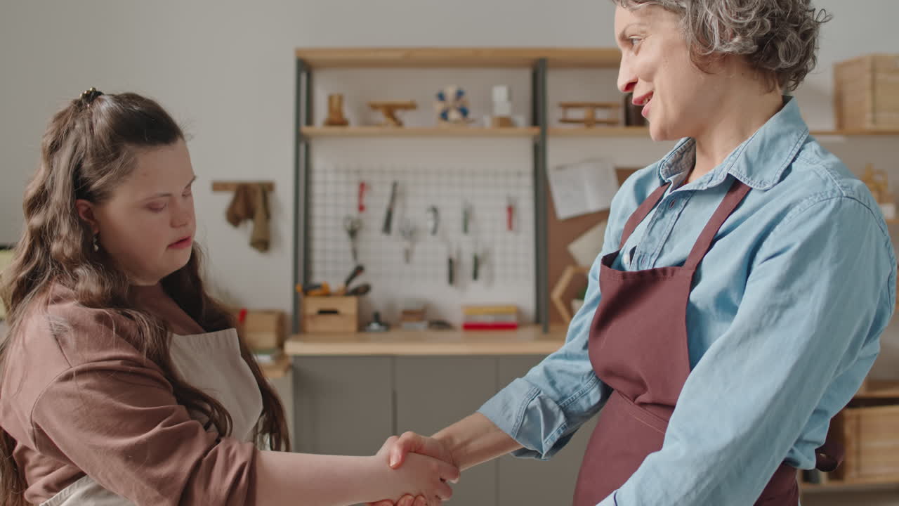 Woman with Down Syndrome Working with Teacher
