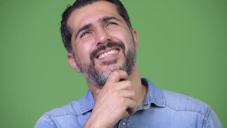 handsome persian bearded man thinking