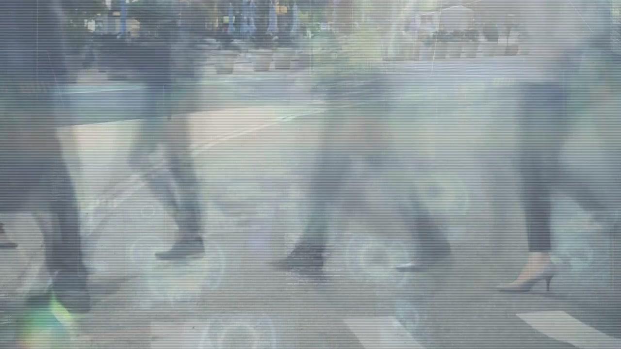 Commuter legs entering left crossing crosswalk while scanline ghosting doubling steps urban transit