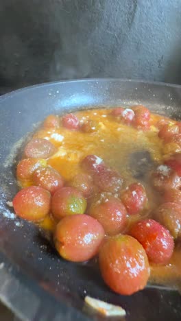 cooking tomatoes in a pan