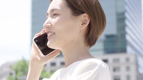 a woman talking on a smartphone