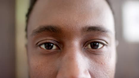 portrait of happy african american businessman in office in slow motion