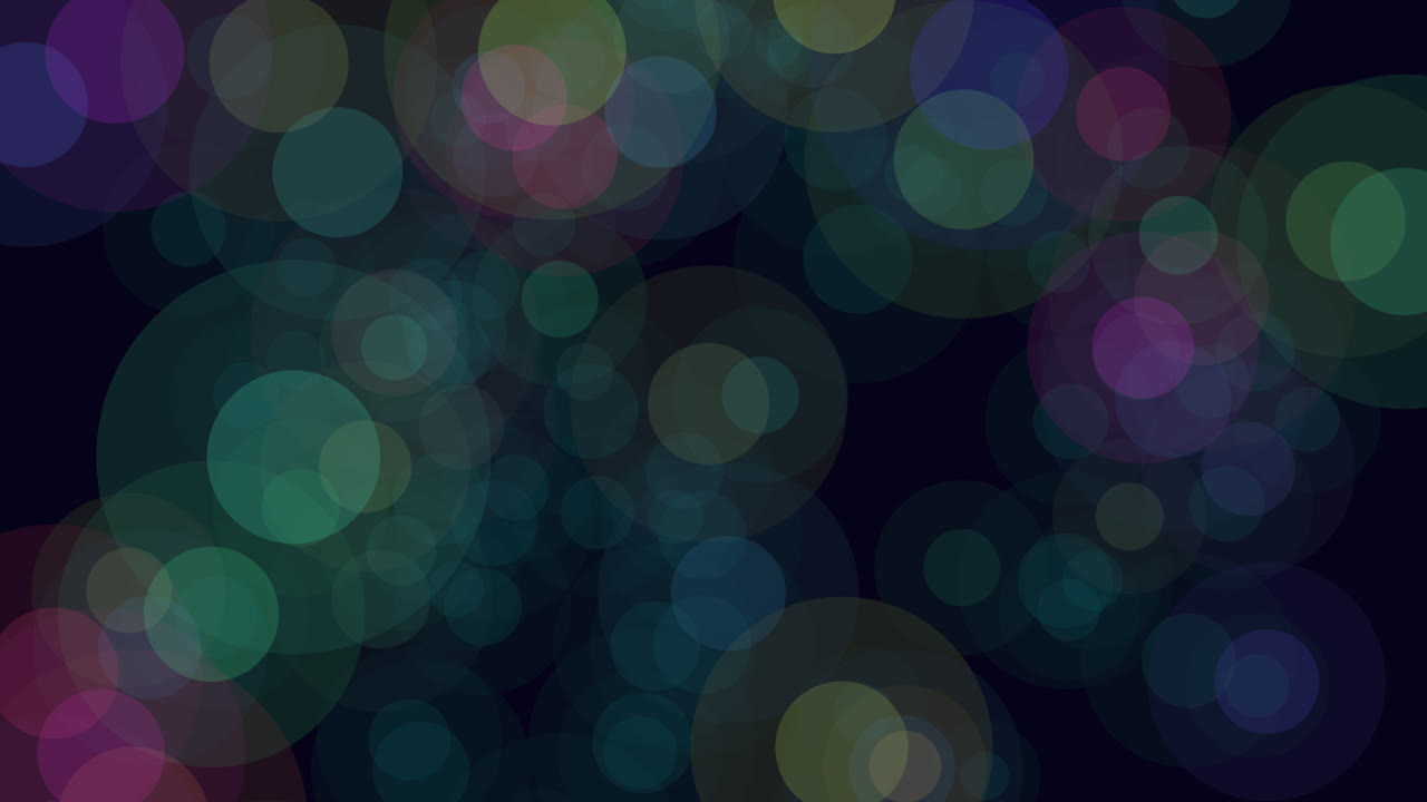 A vibrant display of colorful circles set against a black background, creating a dynamic and energetic pattern with varying hues and overlapping formations, evoking a sense of spinning or motion