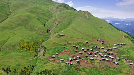 aerial view of highland village on slope of plateau in georgian province adjara