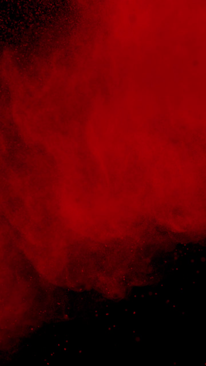 Ripresa in super slow motion di un'esplosione di polvere colorata rossa a 1000 fps - Vista verticale