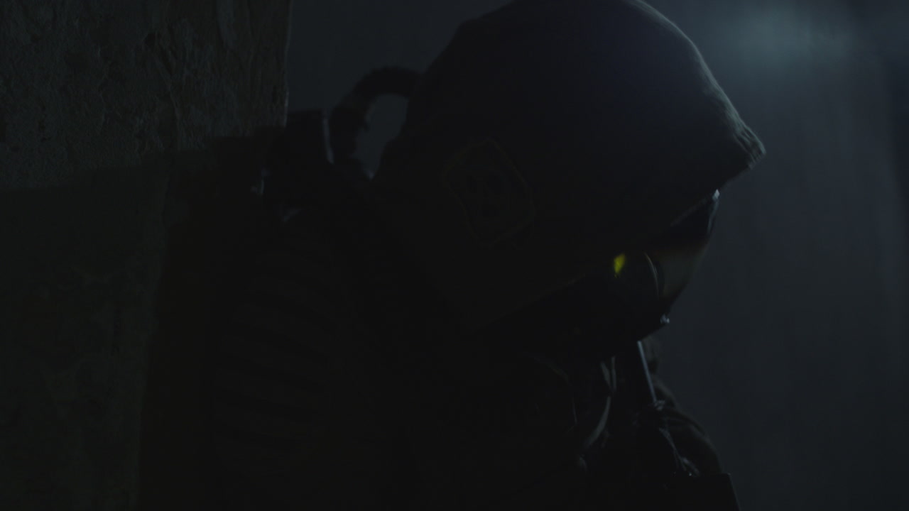 A wounded soldier in the abandoned military complex approaches anomaly