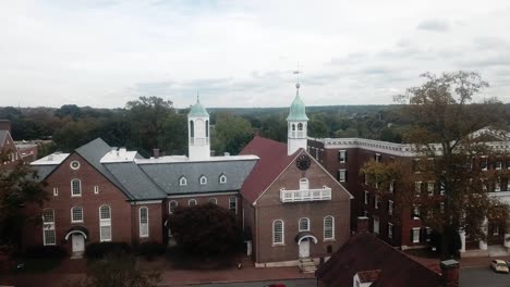 aerial push in to home moravian church in old salem in winston salem nc in fall