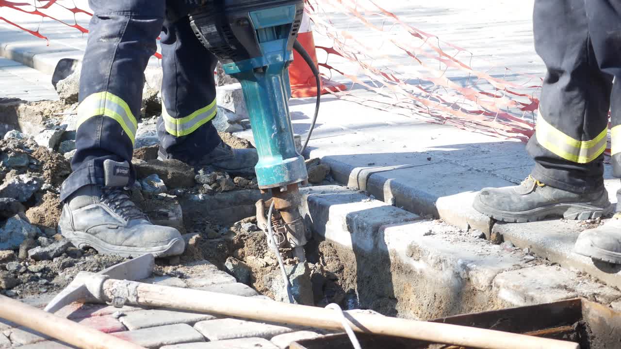 Construction Workers Repairing a Road