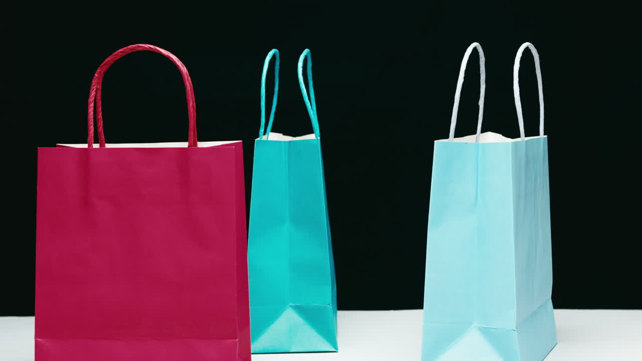 Envelopes falling from above onto a table during Black Friday sales