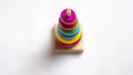 stop motion animation with toy multi-colored pyramid