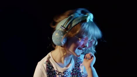 Futuristic-hipster-teen-girl-listening-music-in-headphones,-dancing-in-neon-lights-at-disco-club