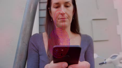 animation of security padlock icon over caucasian woman using smartphone outdoors