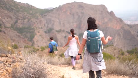 hikers group walk along a rout in the mountain