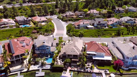 aerial pull back of luxury homes on community lake mission viejo