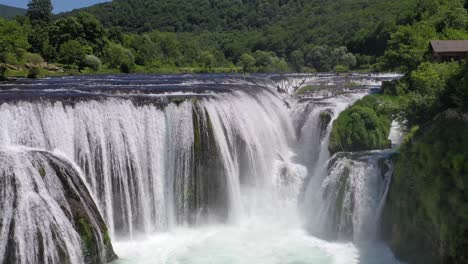 Majestic-Strbacki-Buk-waterfall-in-the-Una-river-at-the-border-with-Bosnia---Herzegovina,-Aerial-dolly-out-shot