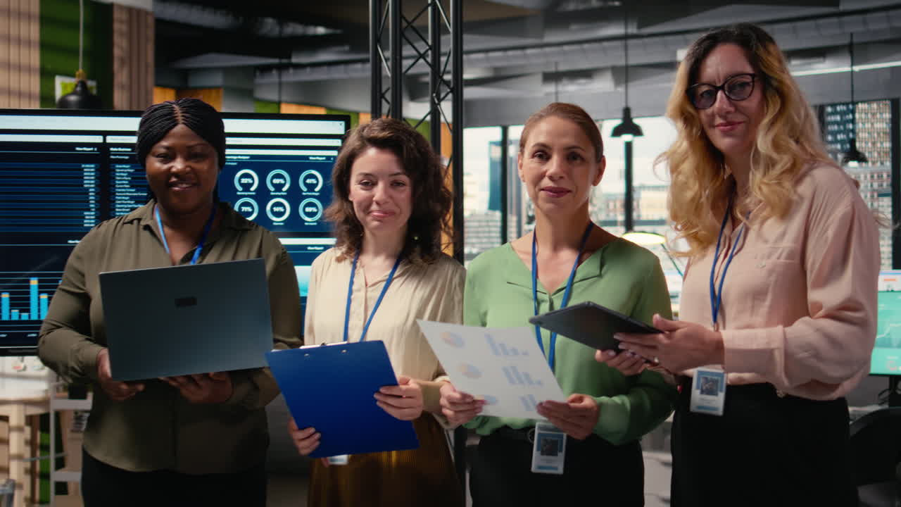 Vertical Video Portrait of diverse group of businesswomen collaborating on report writing