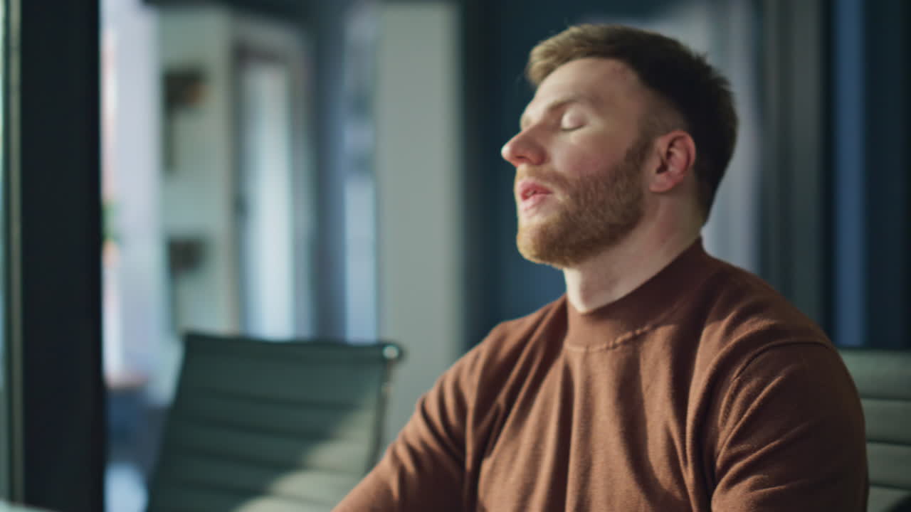 Disappointed freelancer receiving message on cellphone working office closeup