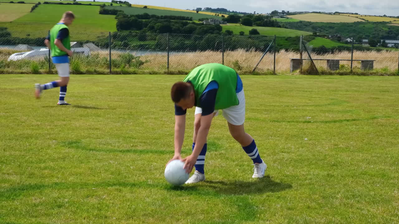 Soccer players practicing on field, focusing on ball control and teamwork
