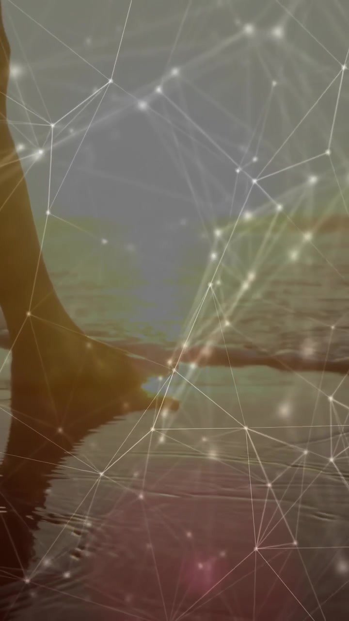 Vertical video: Female dipping foot into water, causing focus shifts and network overlay for tech