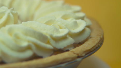 [Camera-Used:-Canon-C300]-Macro-shot-rotating-pumpkin-pie-loaded-with-fluffy-whipped-cream