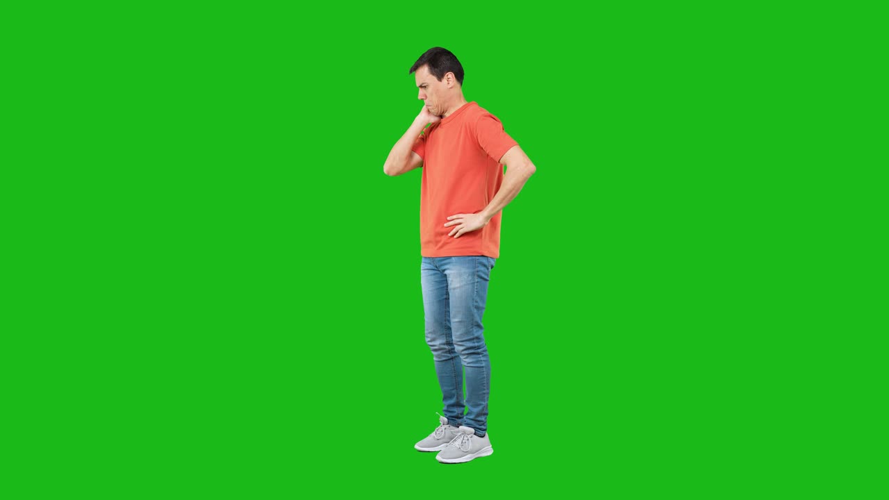 Man in orange t-shirt thinking or contemplating on green screen