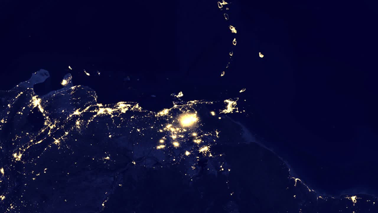 L'animazione digitale sfreccia dallo spazio alle luci illuminate della città di Caracas e delle nazioni insulari caraibiche.