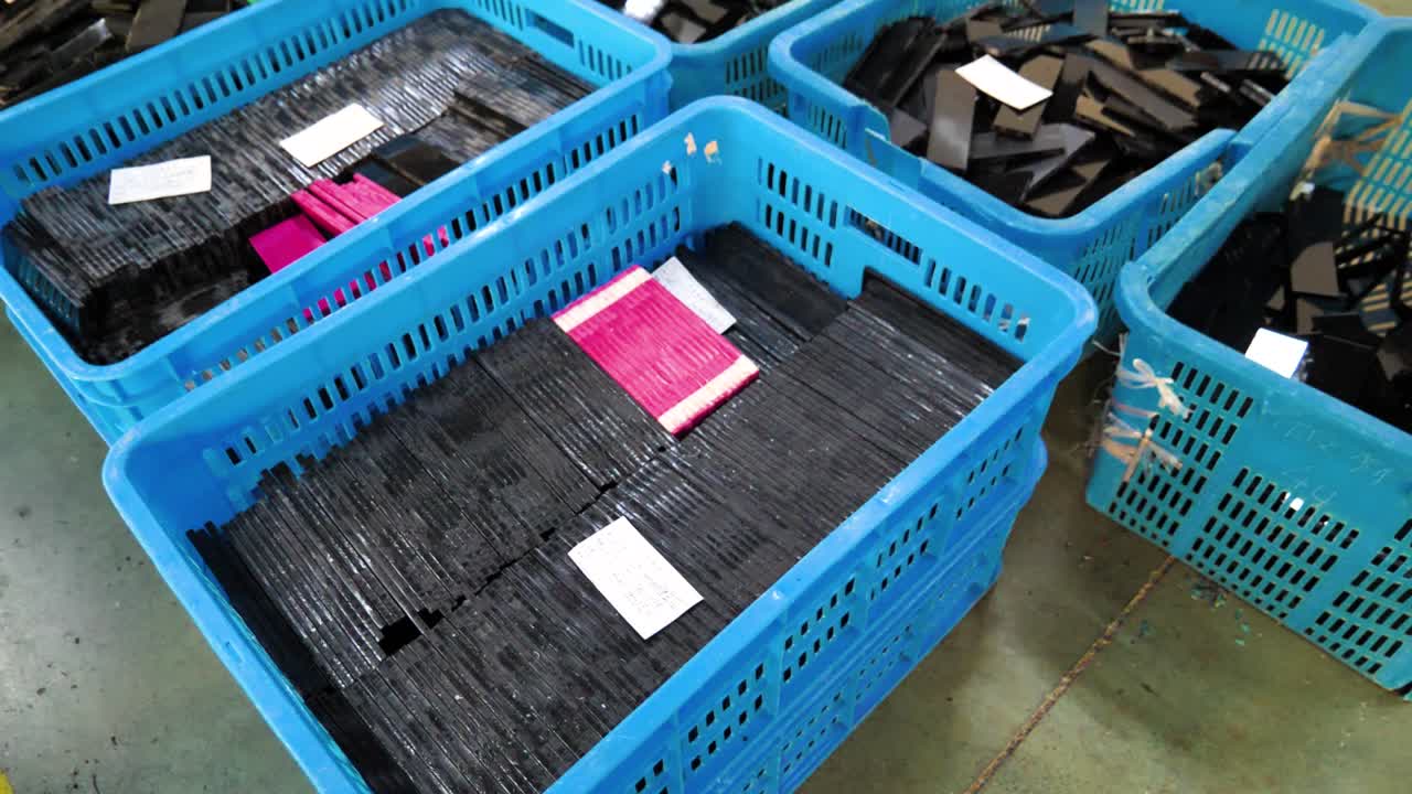 Sorting and Recycling of Broken Glass Pieces in Blue Plastic Crates