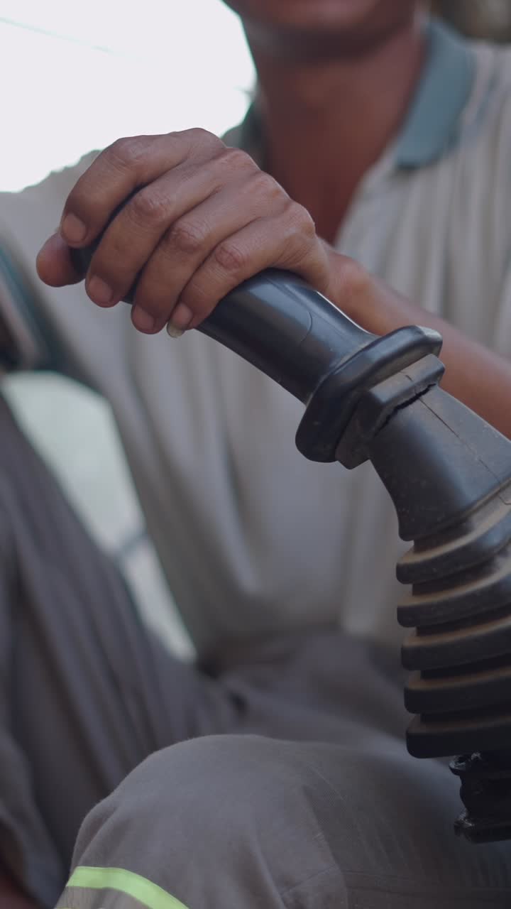 Man operating a lever