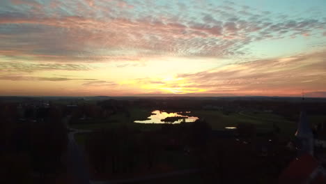 drone capturing sunset over church  in estonia