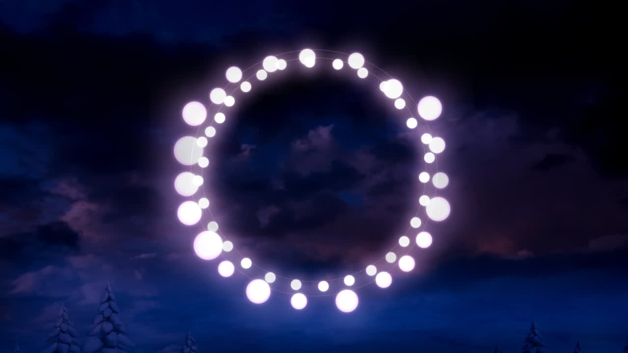 Animation of fairy light frame with copy space over fir trees and winter scenery