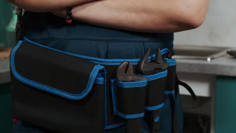 plumber wearing a tool belt