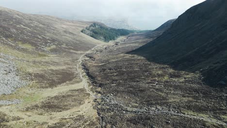 Aerial-view-down-Mourne-Mountains-valley-towards-Newcastle-town