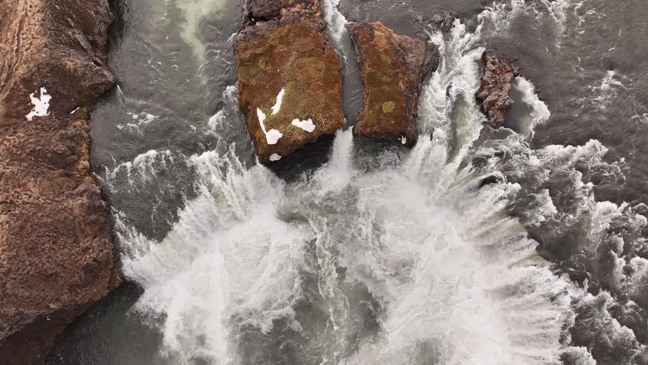 Aerial Overhead Tilt Up of Goðafoss Waterfall in Iceland During an Overcast Winter Day