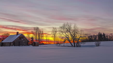 winter countryside landscape with cottage and sauna barrels during sunrise till sunset