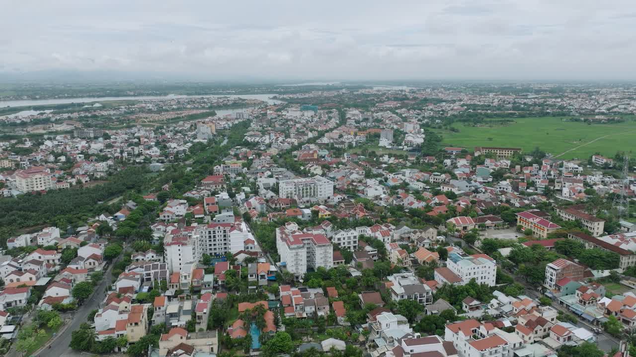 Hoi an, vietnam, showing a mix of urban and green landscapes, aerial view