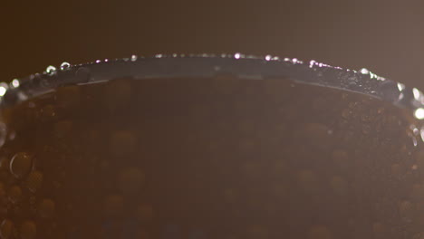 Close-Up-Backlit-Shot-Of-Condensation-Droplets-On-Revolving-Takeaway-Can-Of-Cold-Beer-Or-Soft-Drink-3