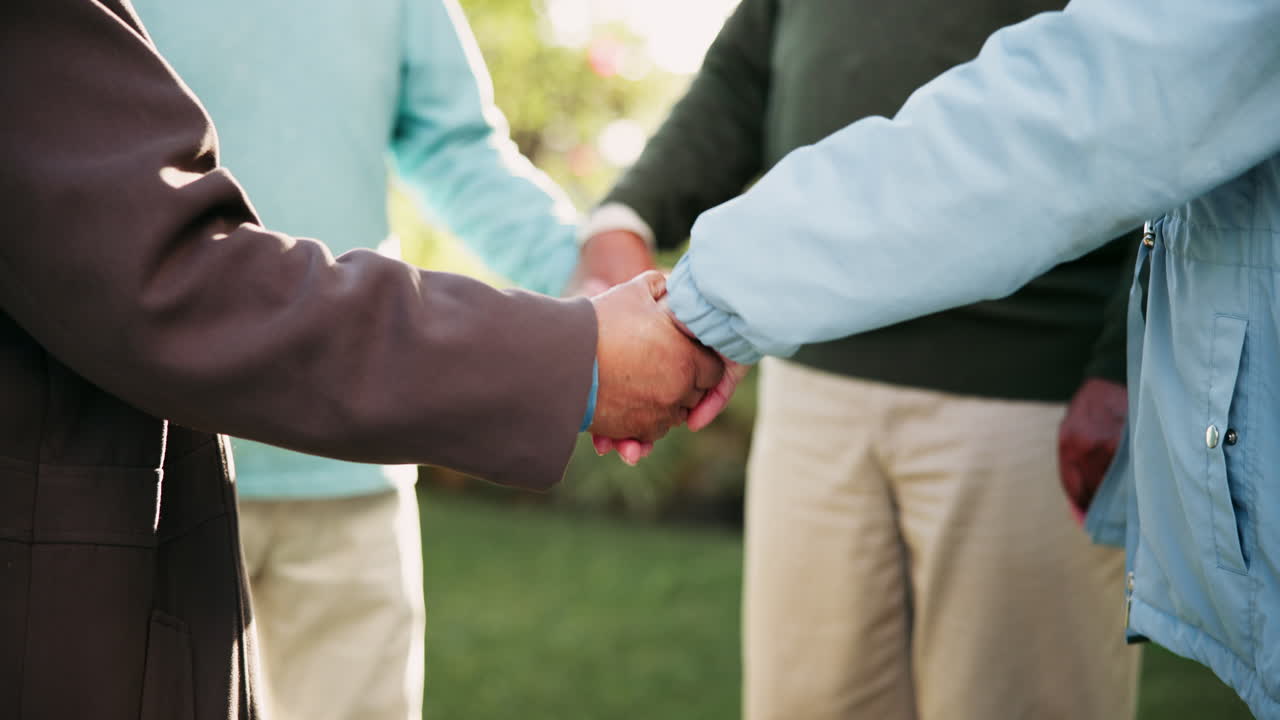 Group holding hands in unity