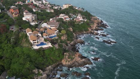 Coastal-real-estate-in-Puerto-Escondido,-Oaxaca,-Mexico,-from-an-aerial-perspective-in-this-drone-video