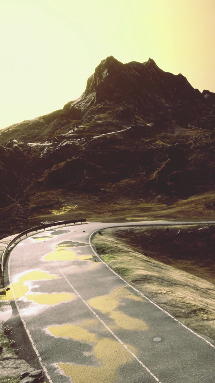 Scenic road winding through mountains under bright sunlight in daytime
