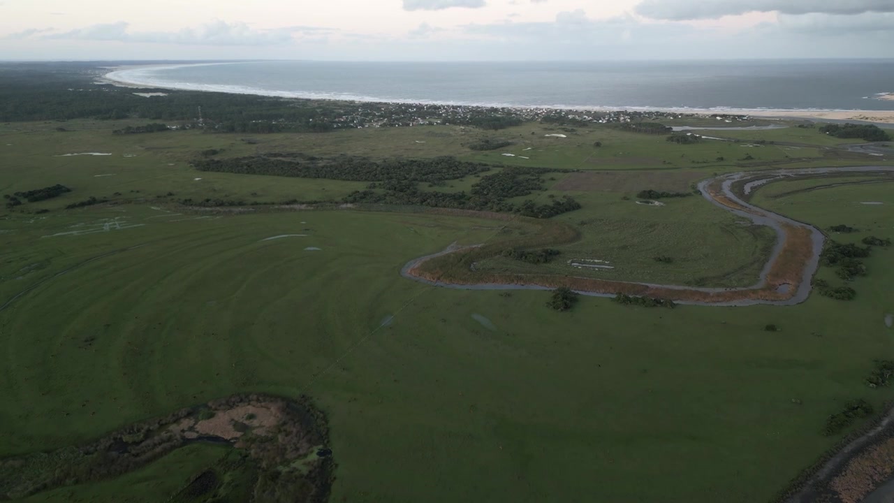 Aerial view of Cabo Polonio National Park with wild nature river and Atlantic Ocean coastline in Uruguay