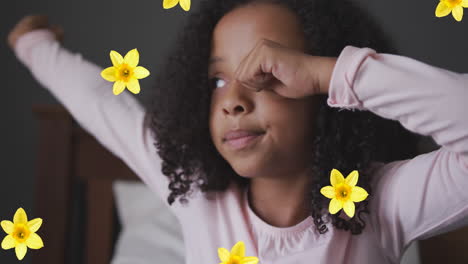 animation of flowers over african american girl waking up
