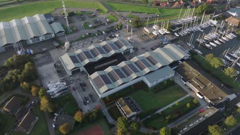 Aerial-view-of-building-with-solar-panels-stations-on-the-roof,-Netherlands