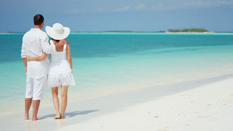 caucasian couple together on a tropical vacation beach