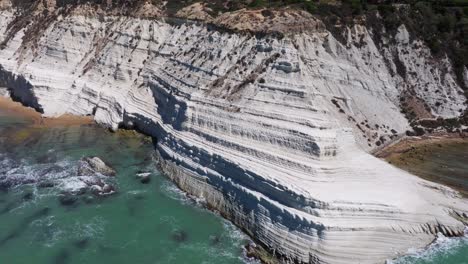 backwards drone shot reveals stair of the turks in sicily, italy