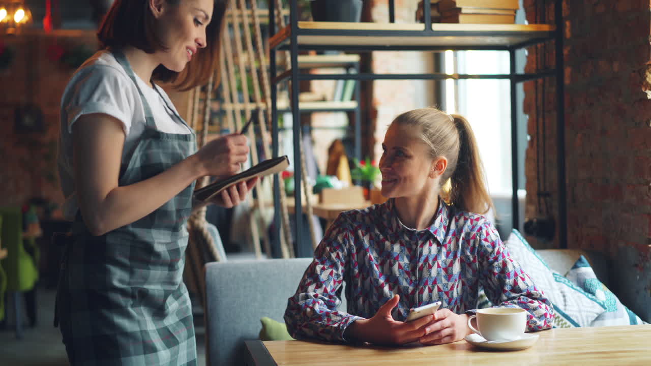 Woman Ordering Food in a Cafe