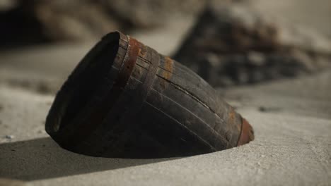 old wooden barrel on the beach