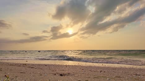 golden hour view of ocean waves and sunset at holbox punta cocos, peaceful and calm