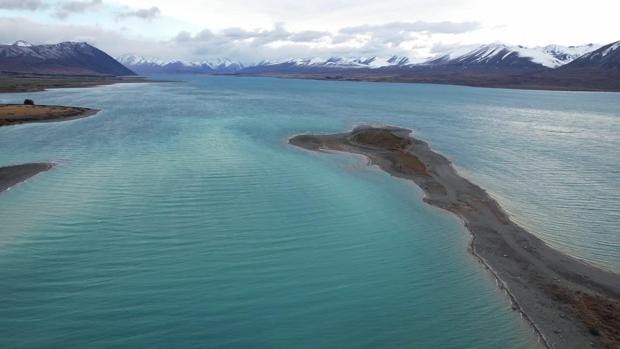 Snowy Mountain Range From Lake Tekapo In Canterbury Region, South Island, New Zealand. - aerial shot